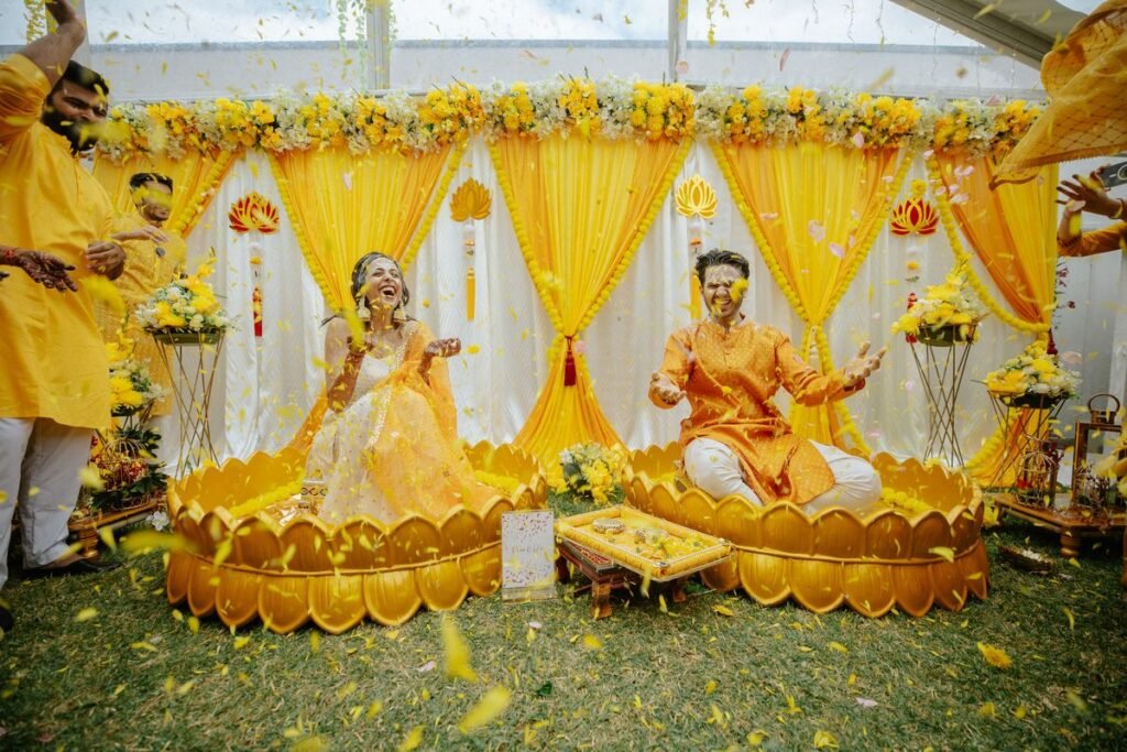 Haldi decoration trends 2026 with marigold flowers and colourful backdrop